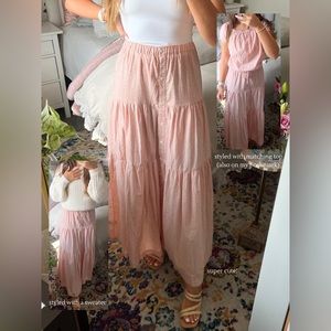 Peach, flowy skirt, with tiny white flowers.